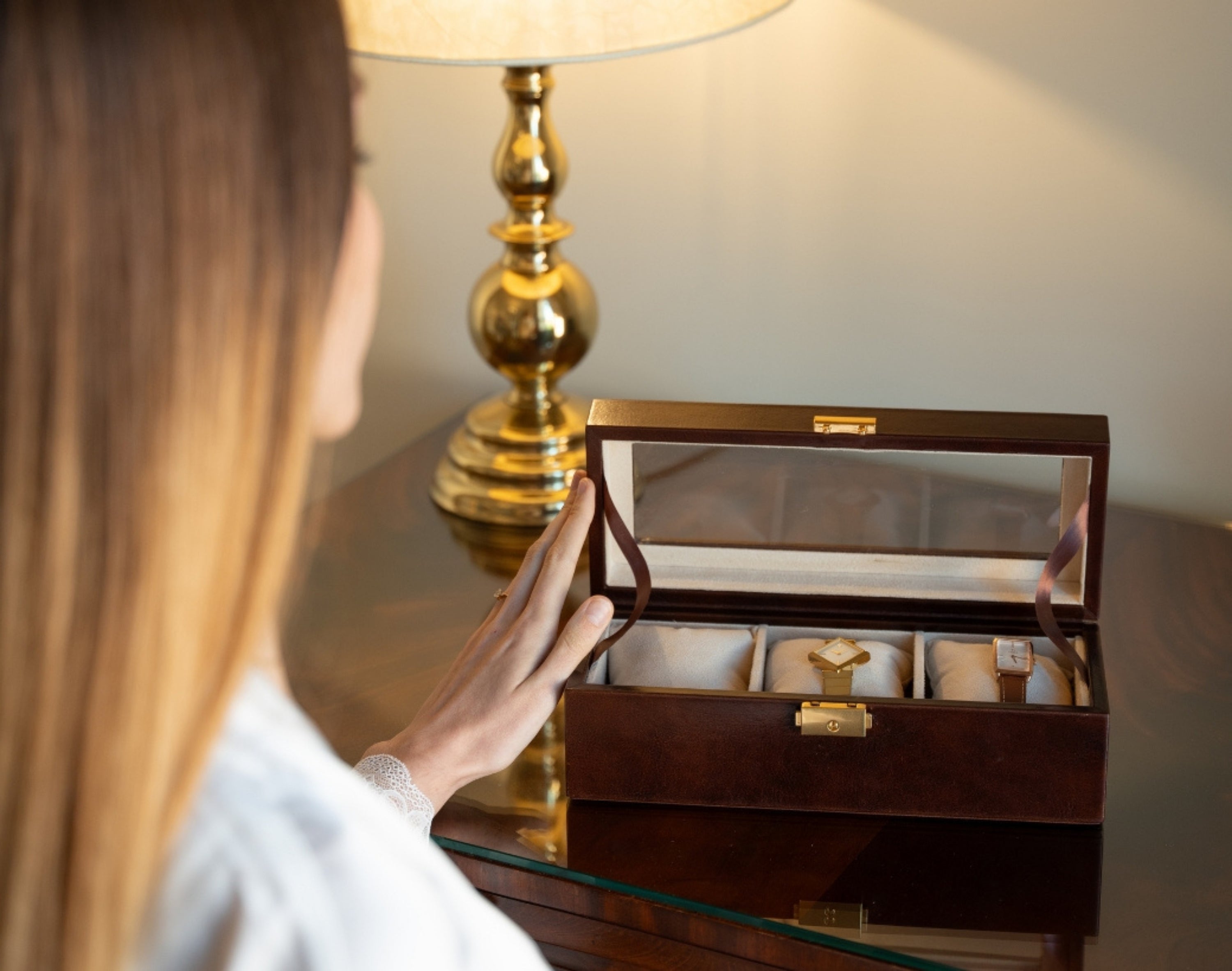 Woman opening leather watch organizer
