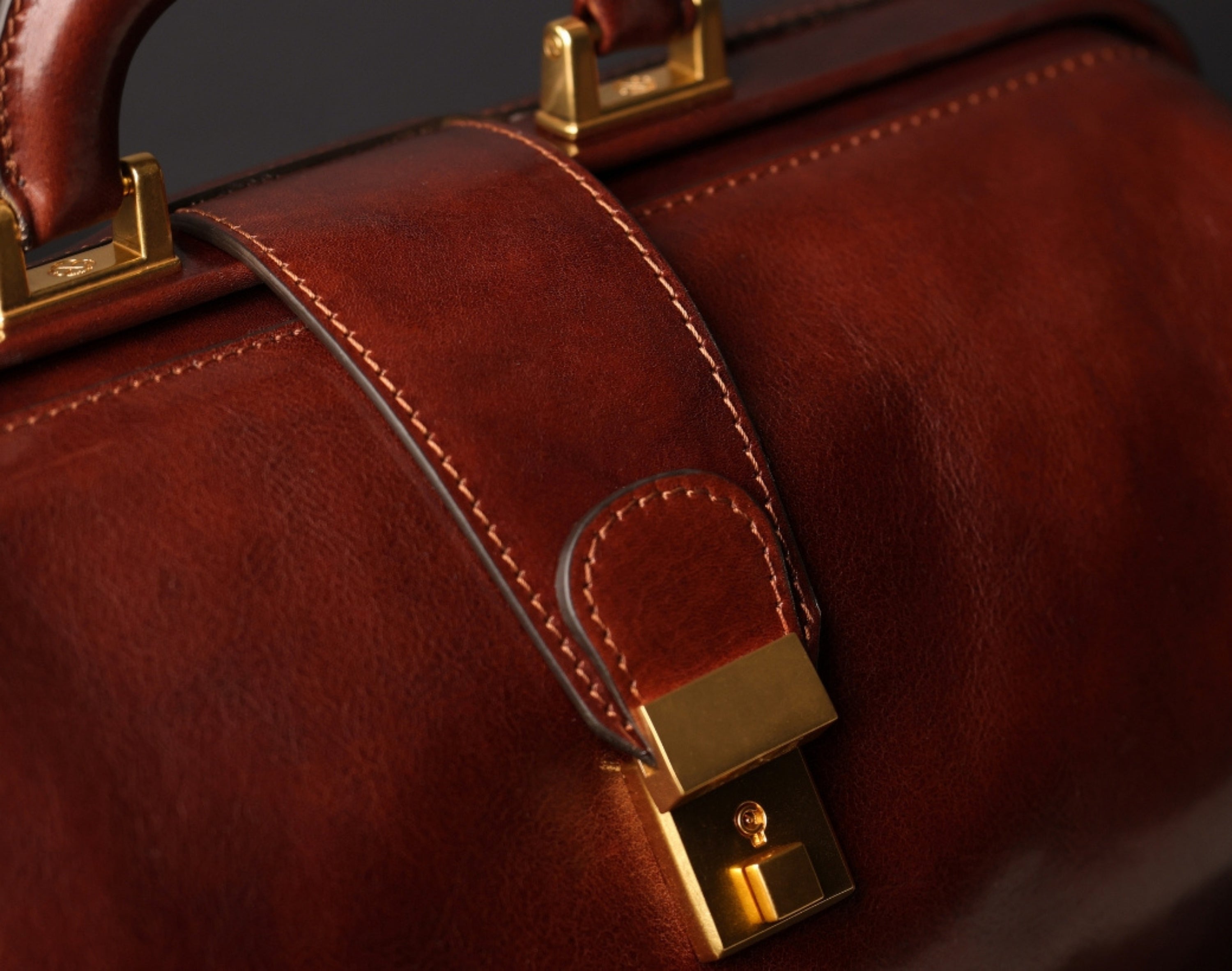 Close-up of a leather briefcase clasp