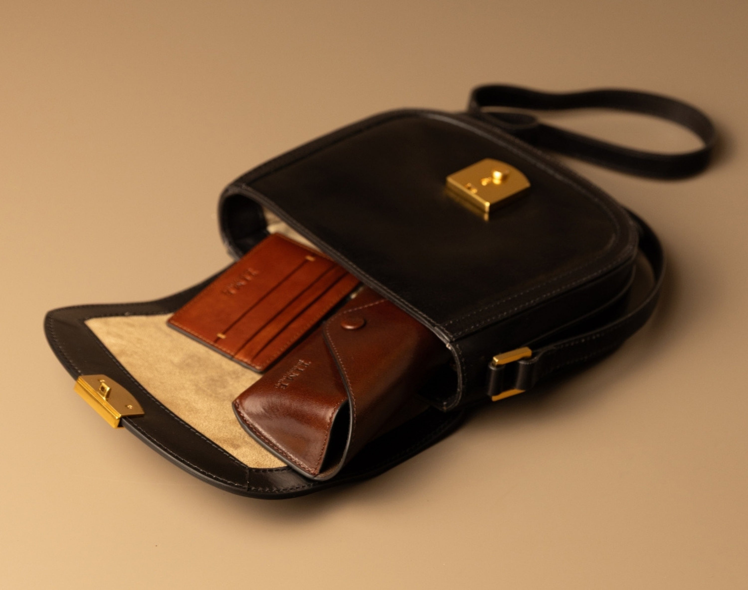 Open leather saddle bag with accessories